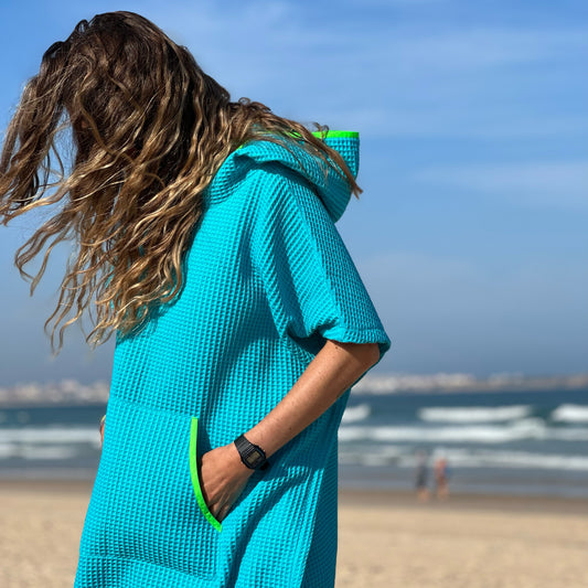 turquoise surfponcho collab surfrider foundation neon green for ocean conservation